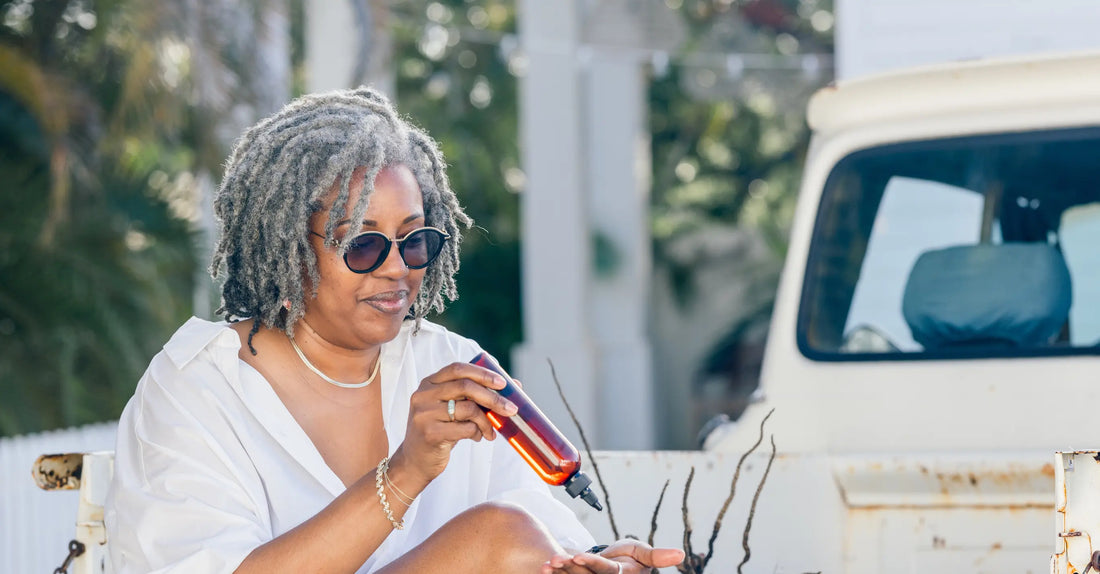 Donata with a bottle of oil pouring into her hand.